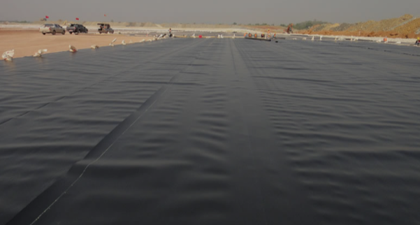 At what temperature does HDPE geomembrane become brittle?